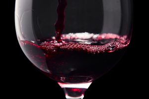 Red wine on a black background ,saved clipping path.